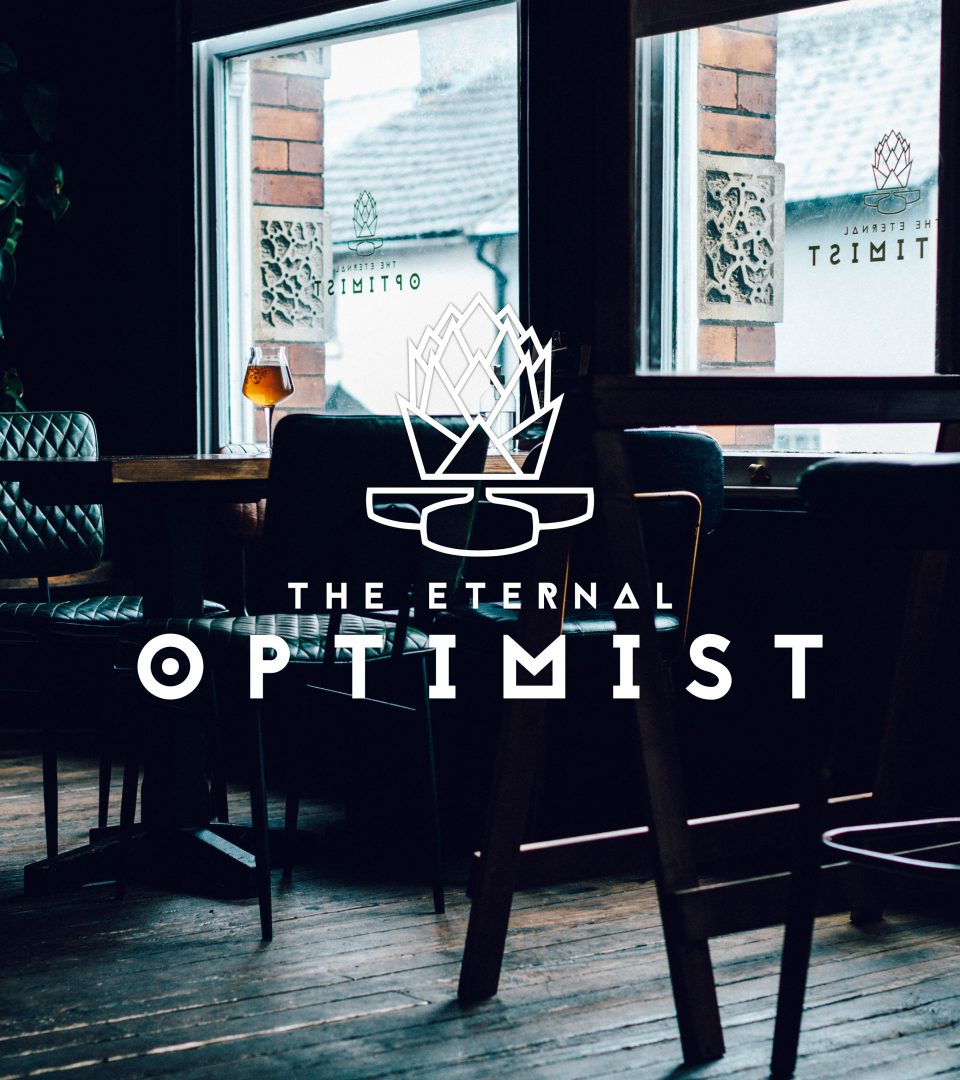 The Eternal Optimist bar setting table next to windows