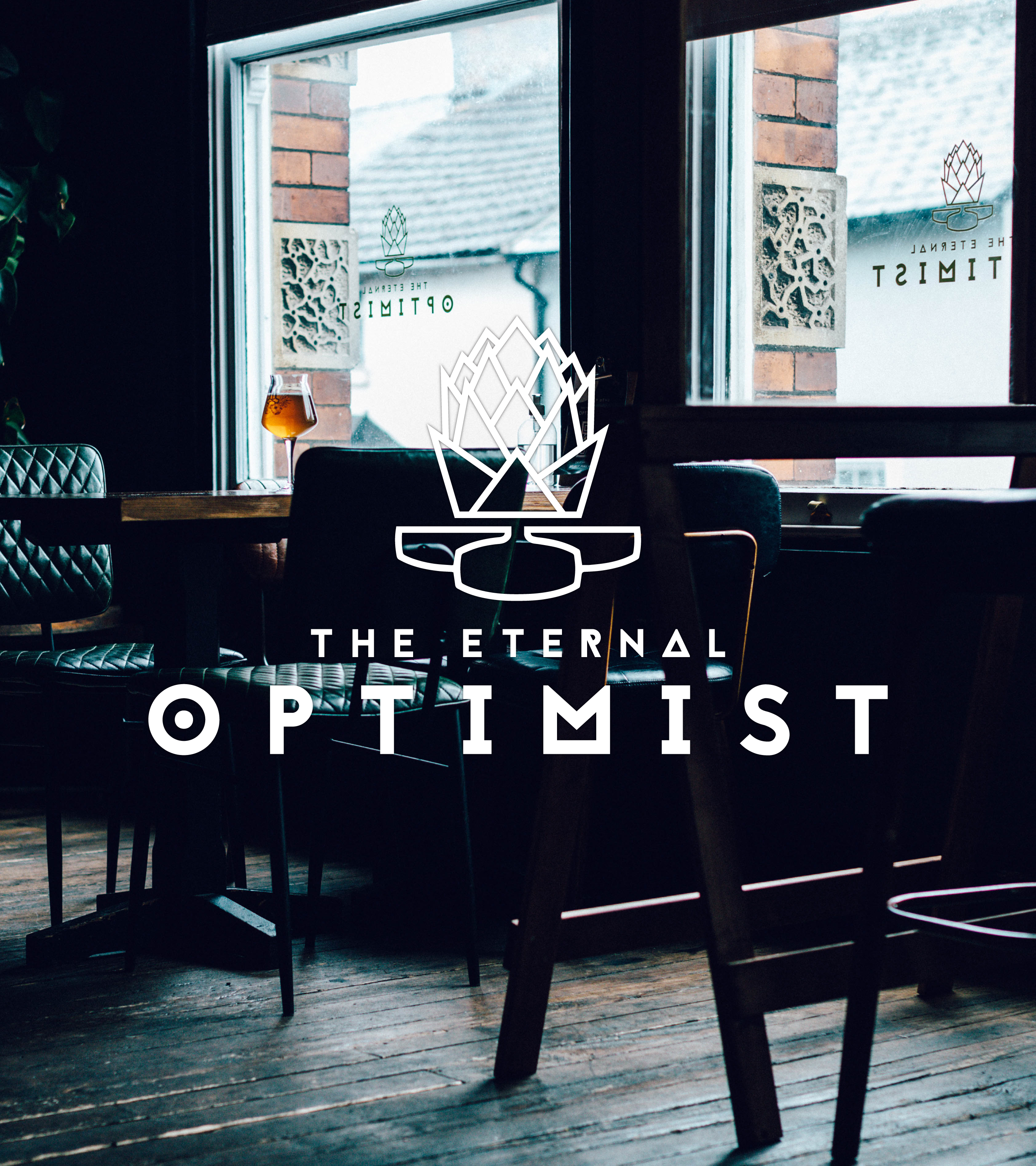 The Eternal Optimist bar setting table next to windows